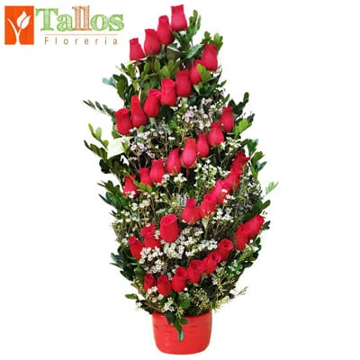 Arreglo floral de rosas rojas en base de cerámica color rojo ideal para regalo elegante por cumpleaños aniversario o cualquier ocasión especial con delivery en Lima