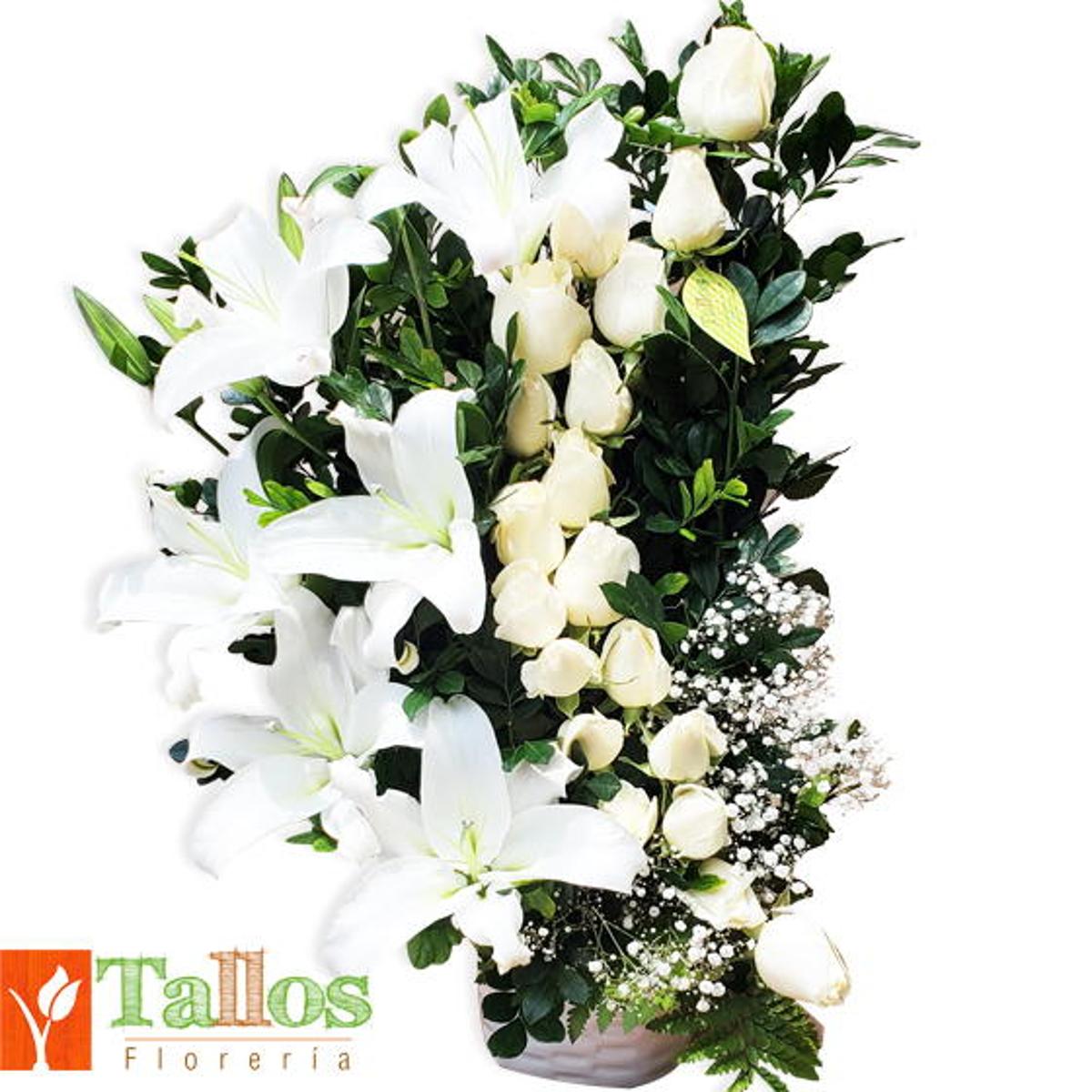 Arreglo floral de condolencias en base de cerámica blanca con rosas blancas y lirios blancos para velorios elegante y sobrio con entrega a domicilio en Lima